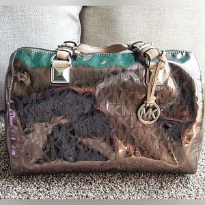 Michael Kors Metallic Monogram Silver Bag.                 14” X 14”/11” X 7”.